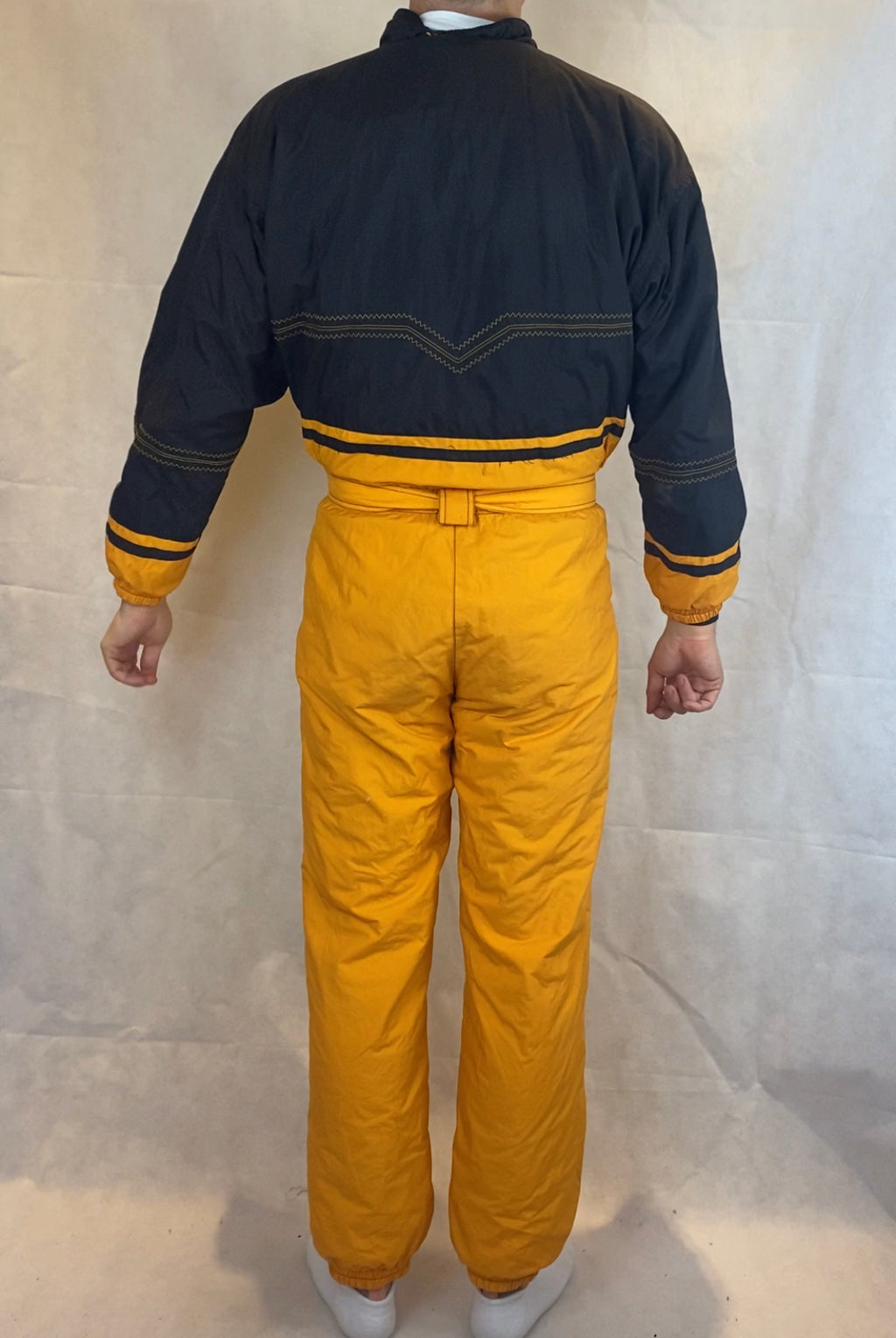 Vintage Skioverall von Diadora in gelb/schwarz in M