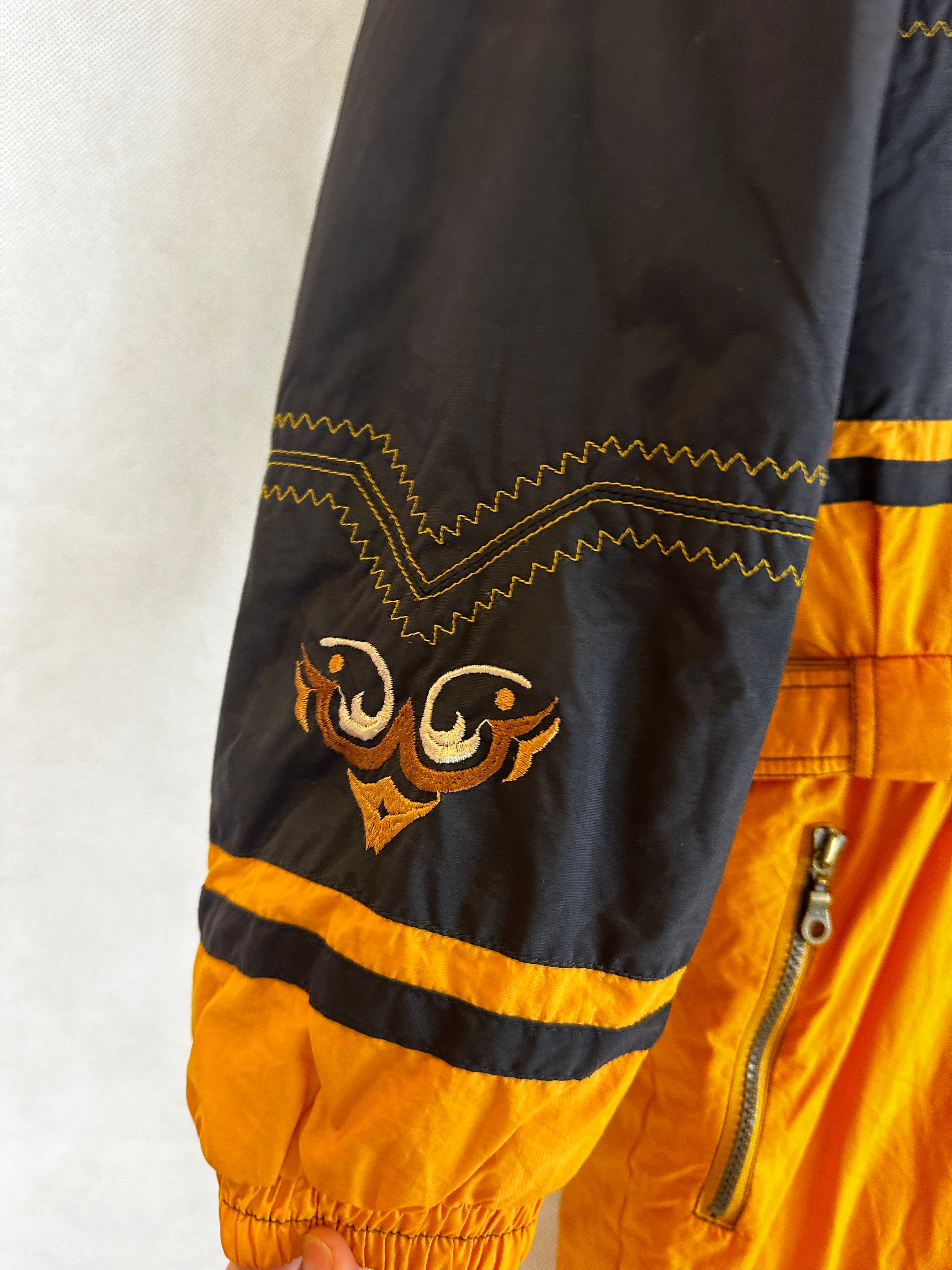 Vintage Skioverall von Diadora in gelb/schwarz in M