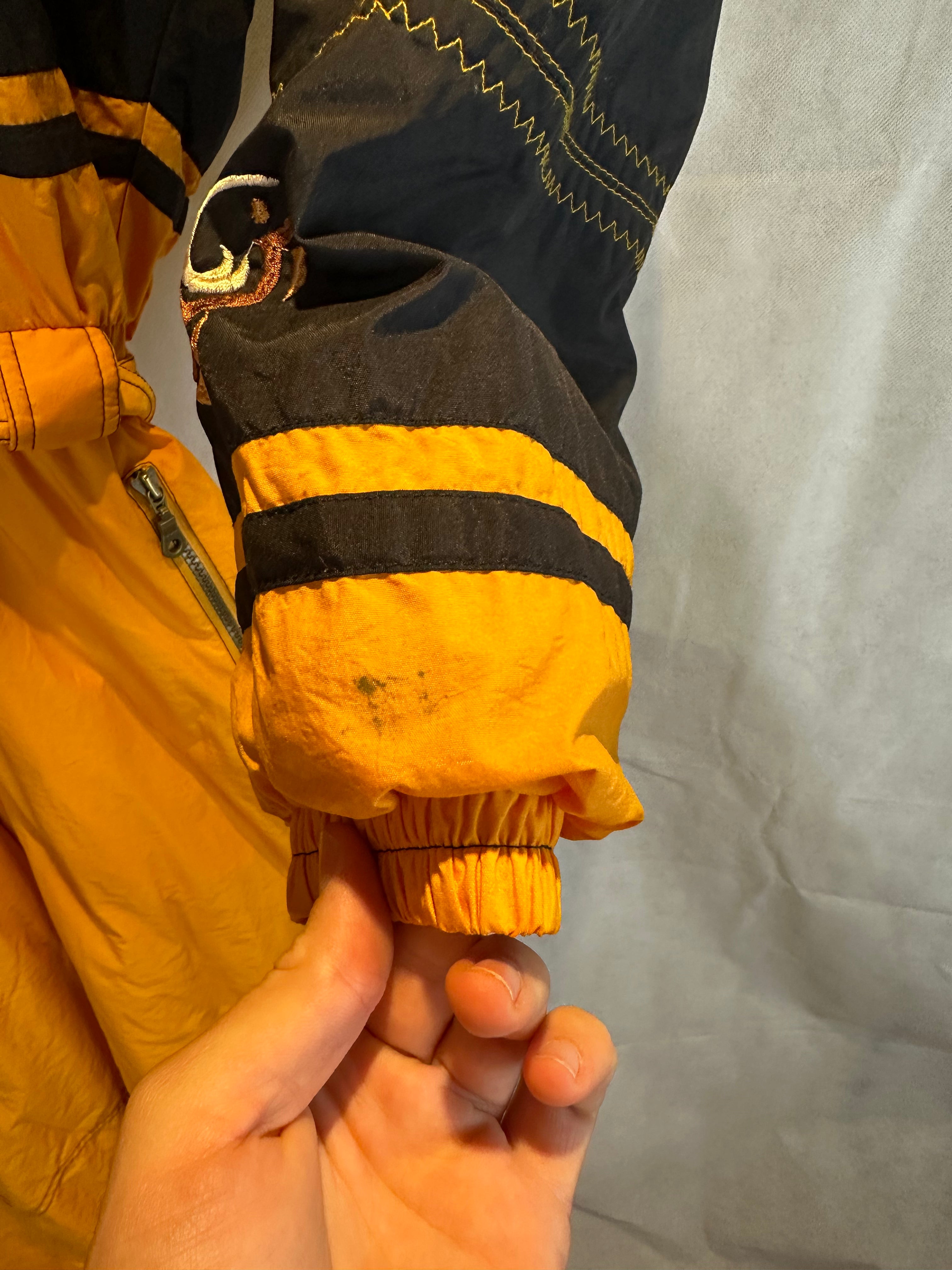 Vintage Skioverall von Diadora in gelb/schwarz in M