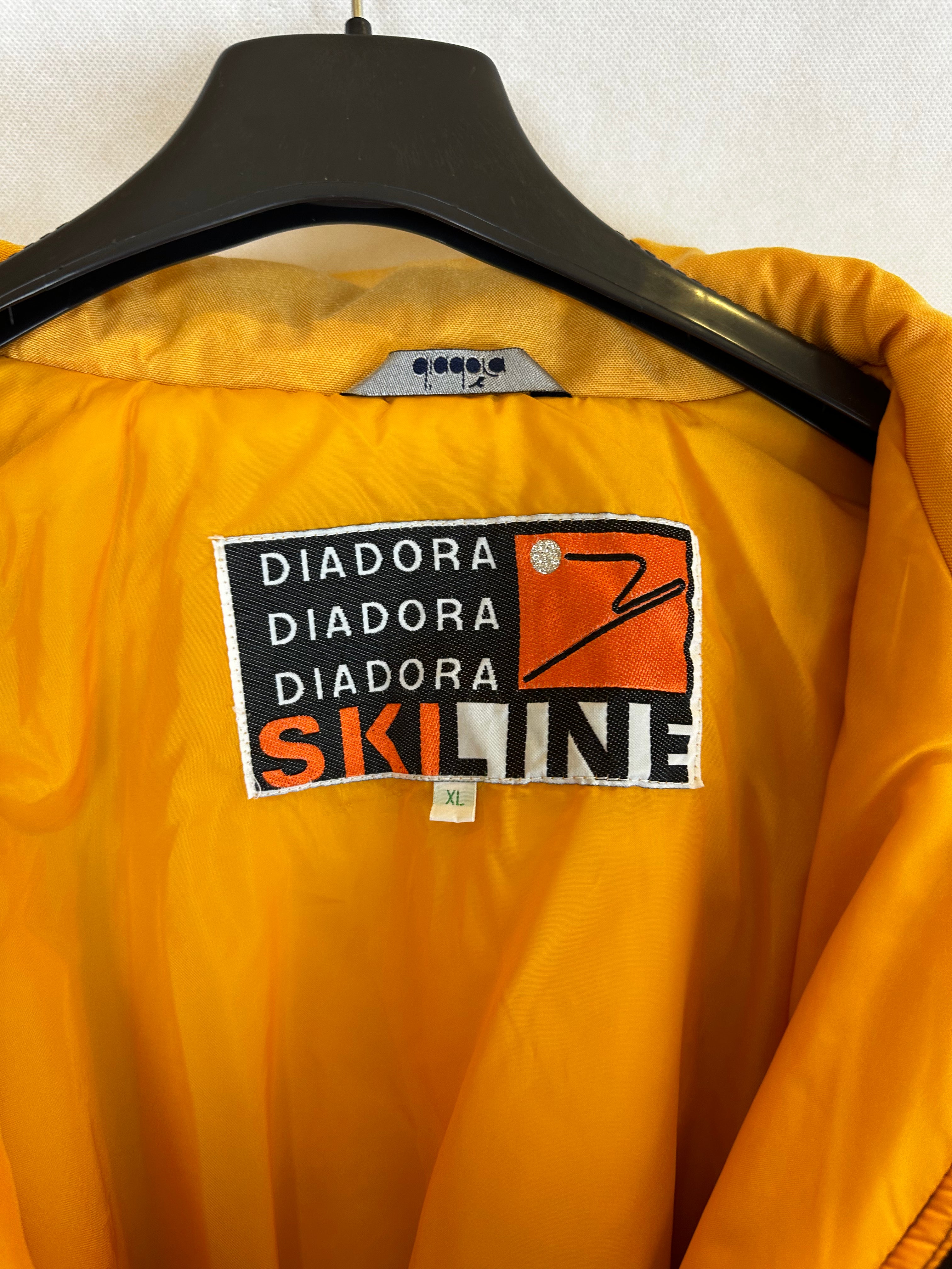 Vintage Skioverall von Diadora in gelb/schwarz in M