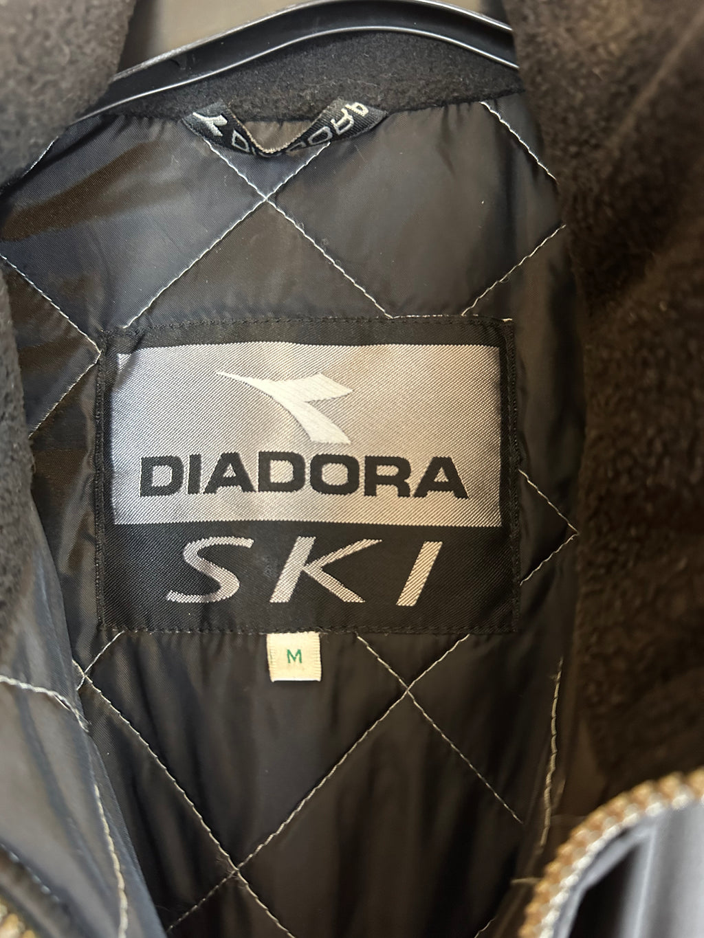 Vintage Skioverall von DIADORA in Schwarz/Silber S/M