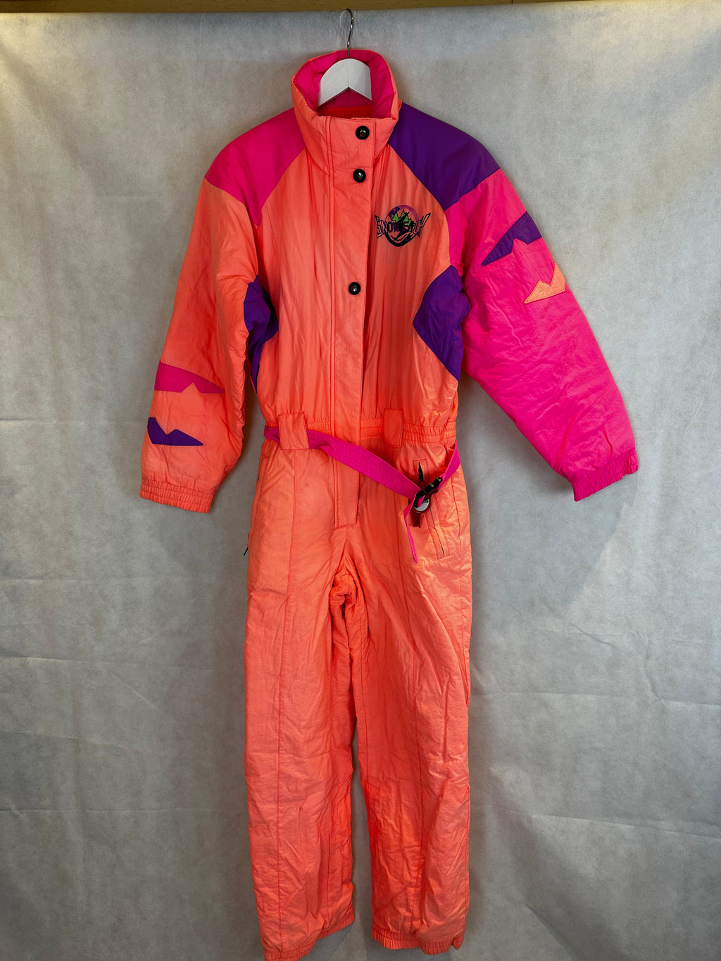 Vintage Skioverall von FILA in rosa/orange in S/M