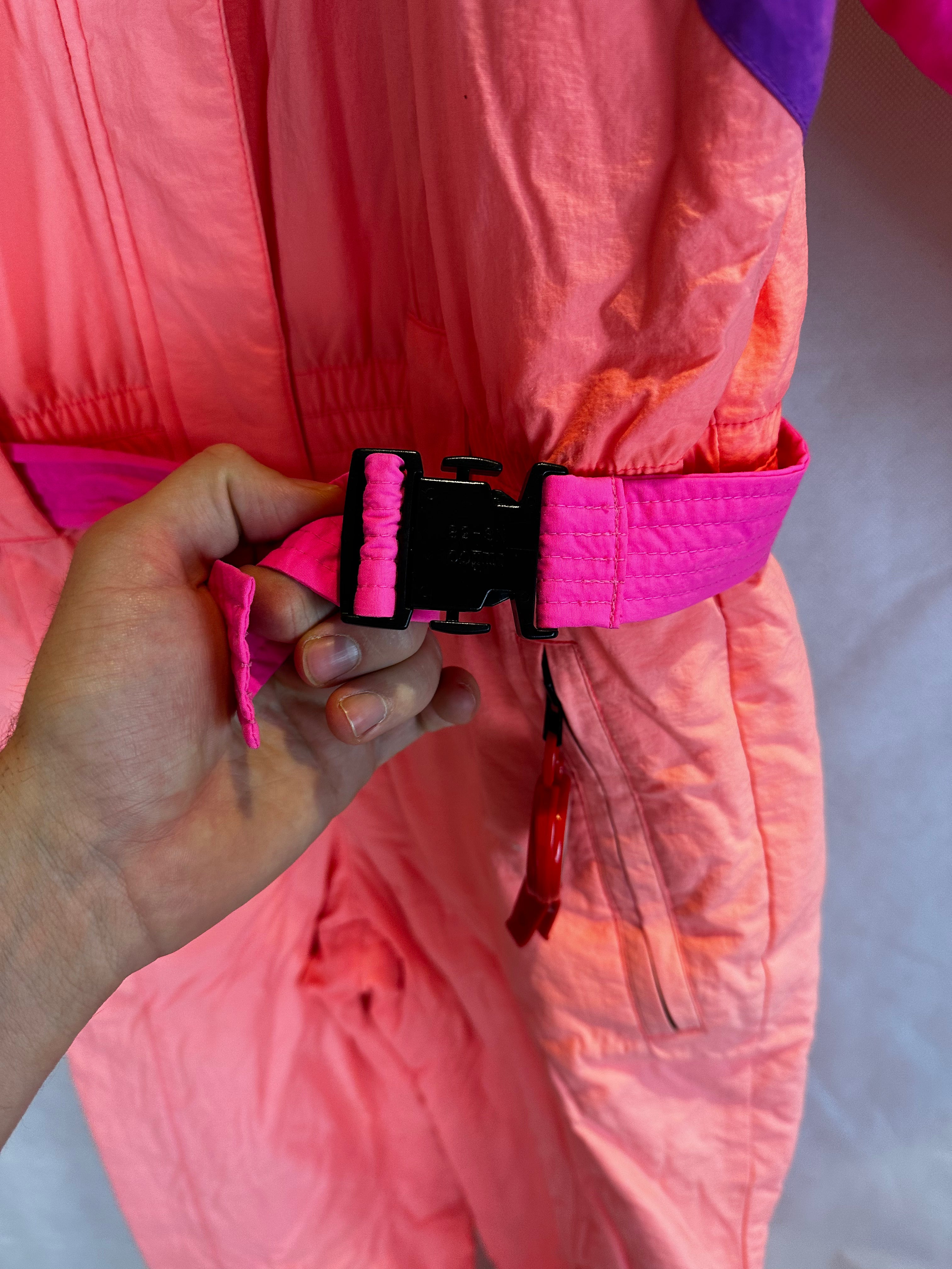 Vintage Skioverall von FILA in rosa/orange in S/M