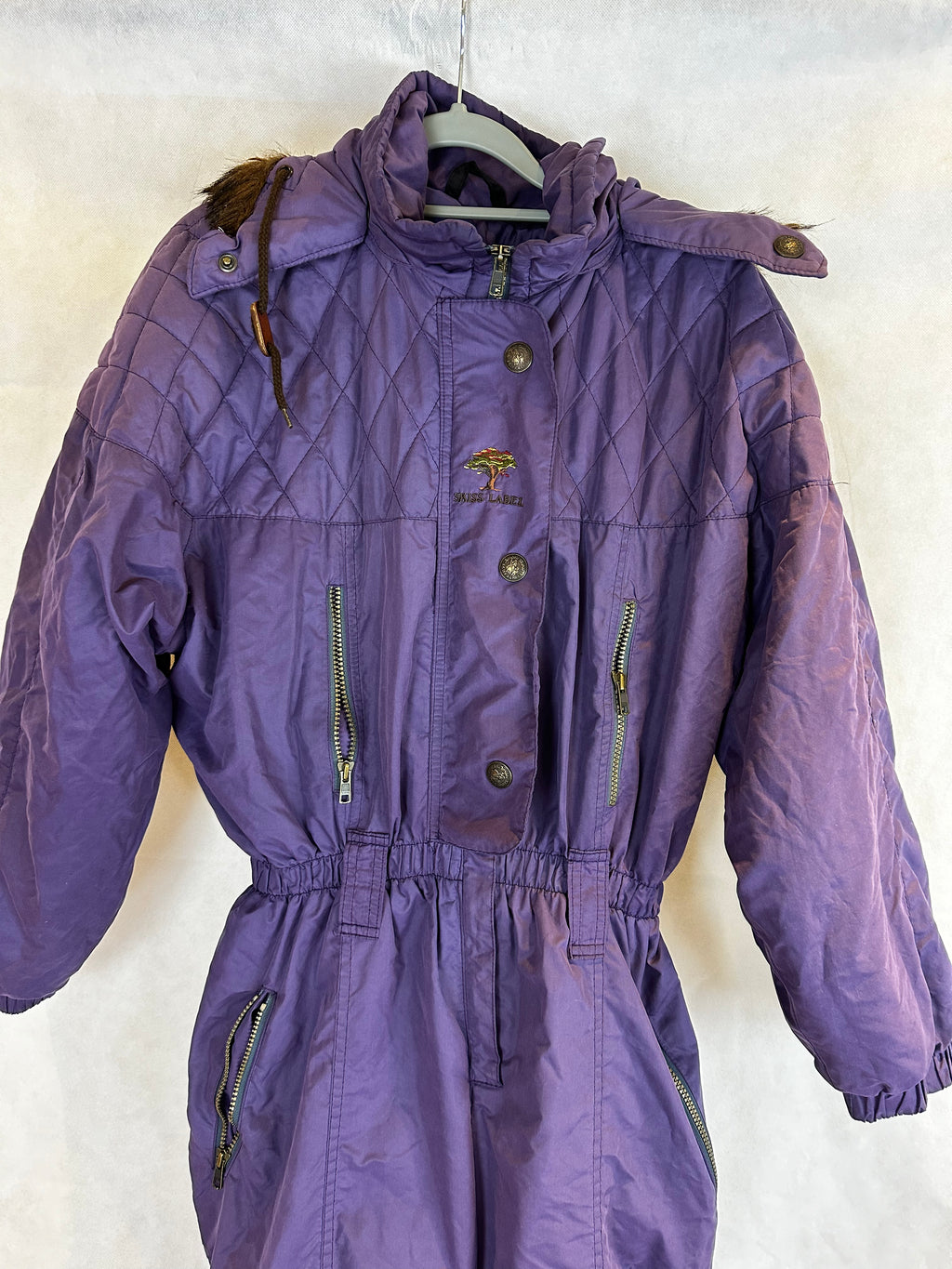 Vintage Skioverall  in lila mit fell an der kaputze