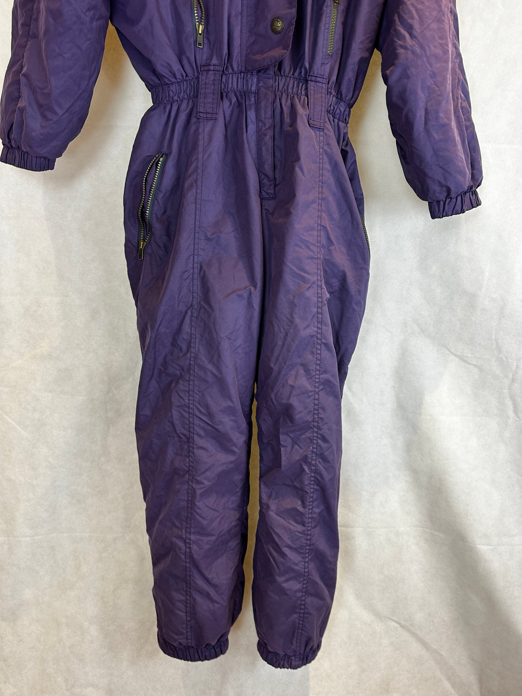 Vintage Skioverall  in lila mit fell an der kaputze