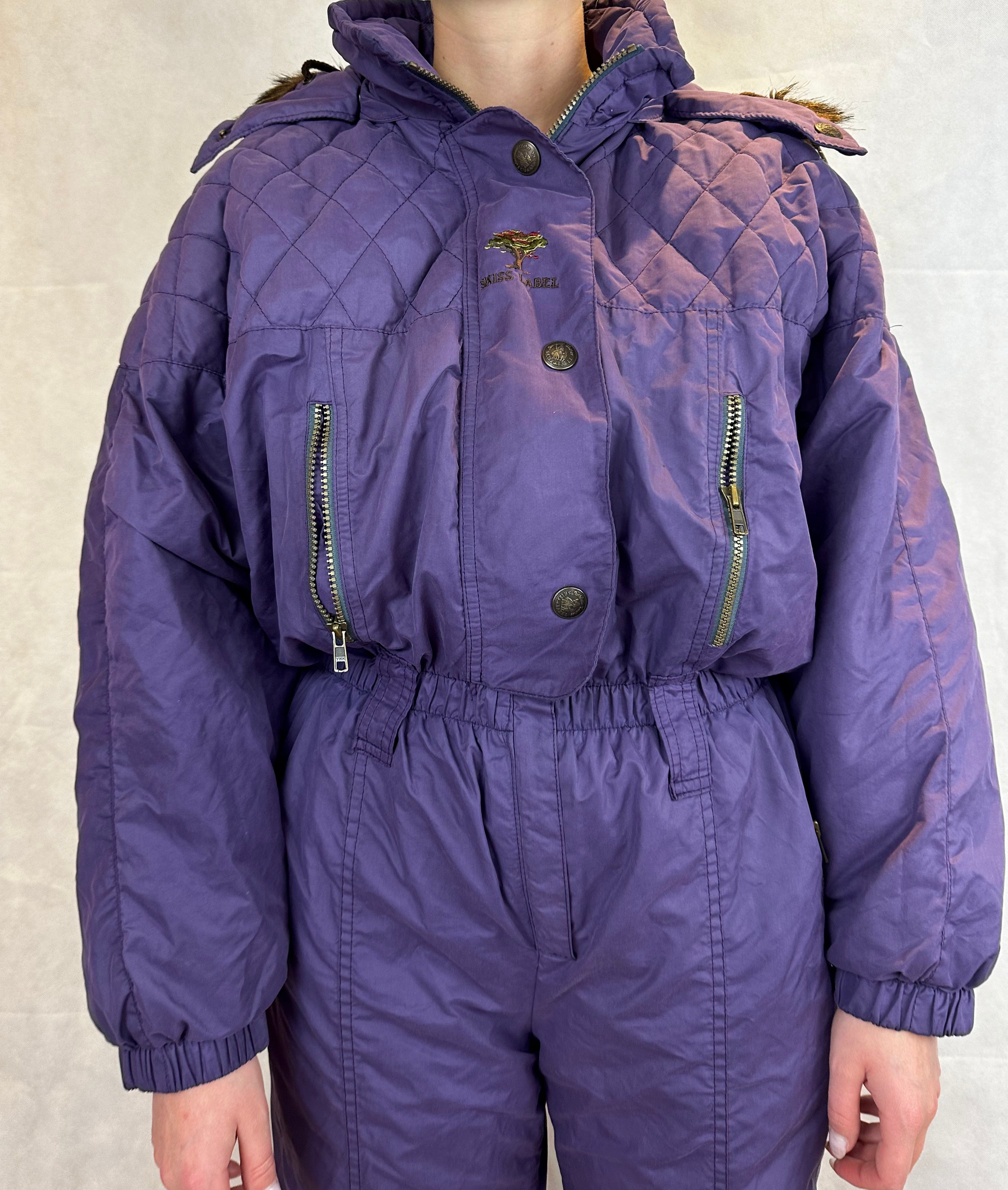 Vintage Skioverall  in lila mit fell an der kaputze